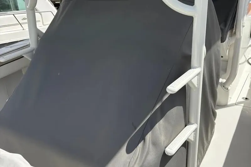 Slide: The Image of 2017 Jupiter 38 FS boat with covered console and white ladder. - 37