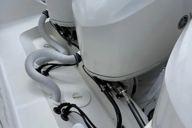 Slide: The Image of 2017 Jupiter 38 FS boat engines with cables and hoses in close-up view. - 8