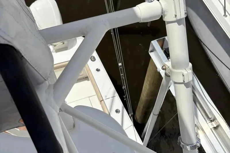 Slide: The Image of 2017 Jupiter 38 FS boat deck with white railing and dock view. - 9