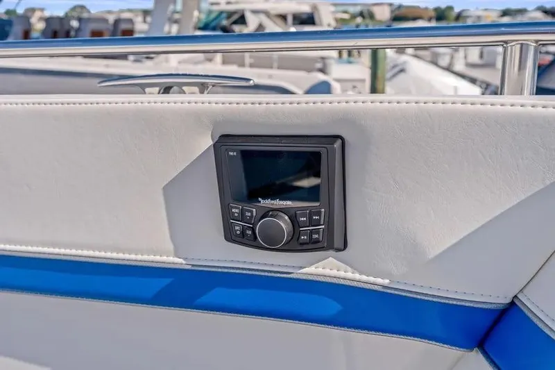 Slide: The Image of 2024 Formula 380 Super Sport Crossover OB boat with integrated audio control panel. - 11