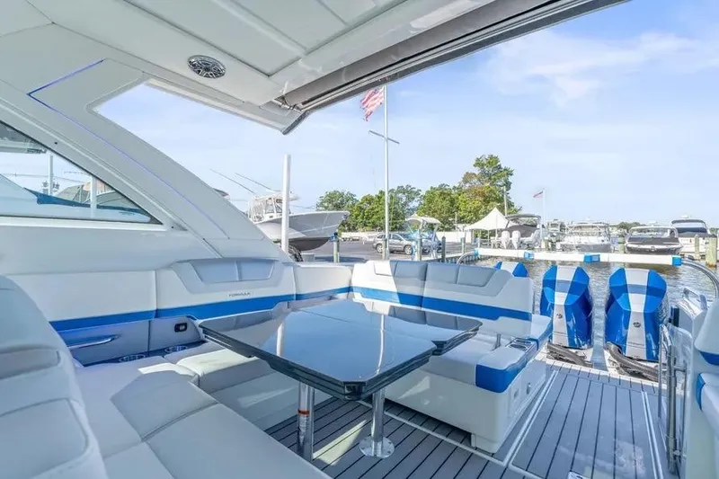 Slide: The Image of 2024 Formula 380 Super Sport Crossover OB luxury boat interior at marina. - 20