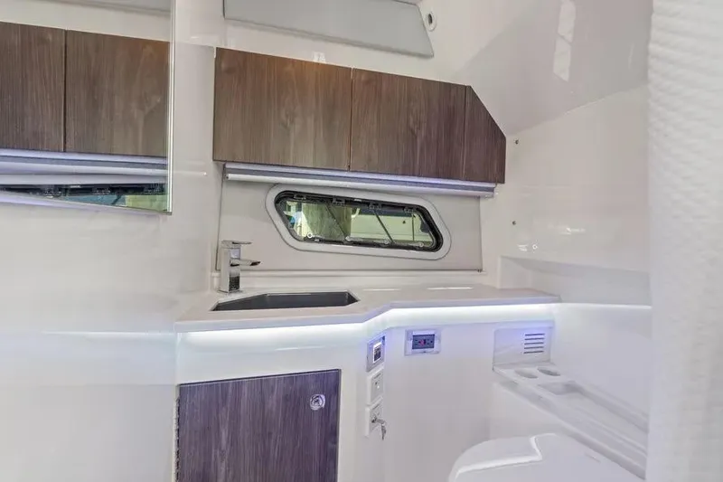 Slide: The Image of 2024 Formula 380 Super Sport Crossover OB interior with modern kitchenette design. - 27