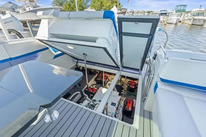 Slide: The Image of 2024 Formula 380 Super Sport Crossover OB engine compartment, open hatch, docked at marina. - 31