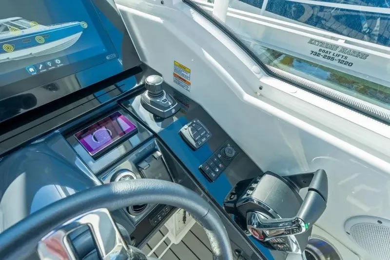 Slide: The Image of 2024 Formula 380 Super Sport Crossover OB helm with advanced controls and touchscreen display. - 33