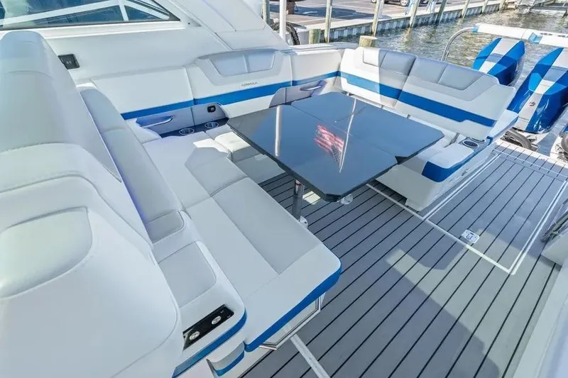 Slide: The Image of 2024 Formula 380 Super Sport Crossover OB interior with sleek seating and modern table design. - 36