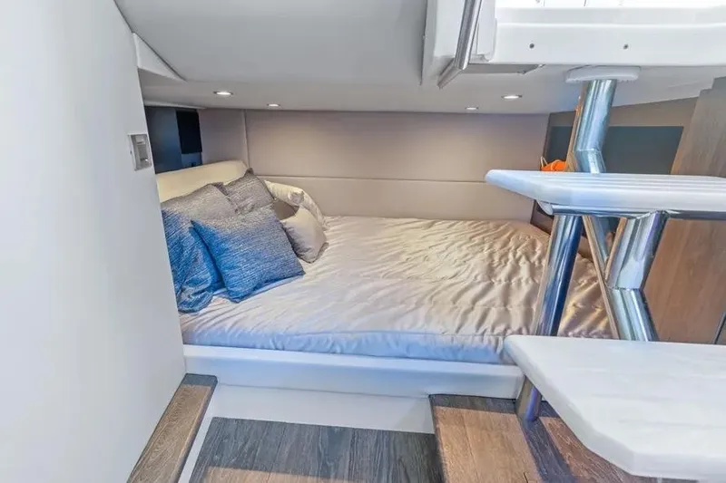 Slide: The Image of 2024 Formula 380 Super Sport Crossover OB cabin with cozy bed and modern design. - 38