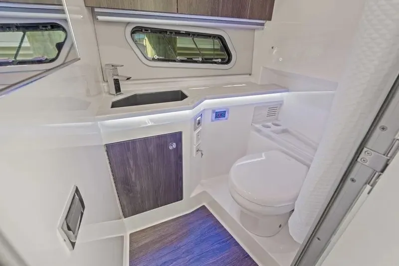Slide: The Image of 2024 Formula 380 Super Sport Crossover OB bathroom with modern fixtures and sleek design. - 42