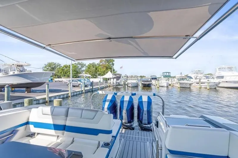 Slide: The Image of 2024 Formula 380 Super Sport Crossover OB at marina, showcasing luxury seating and powerful engines. - 43