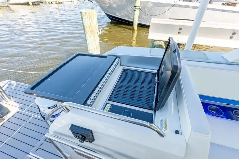 Slide: The Image of 2024 Formula 380 Super Sport Crossover OB boat with outdoor grill station. - 44