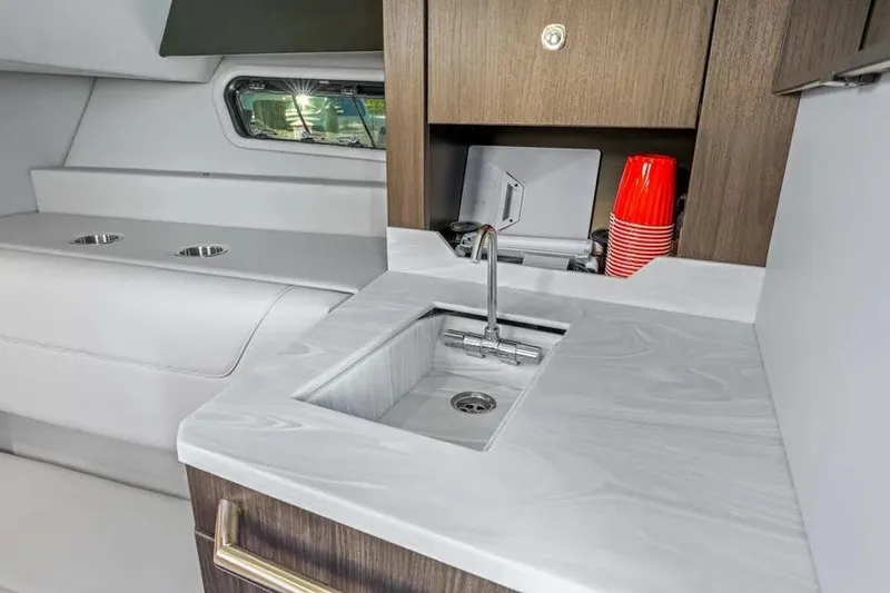 Slide: The Image of 2024 Formula 380 Super Sport Crossover OB interior with modern kitchenette and sleek design. - 47