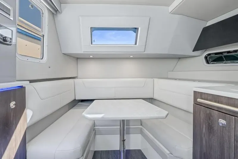 Slide: The Image of 2024 Formula 380 Super Sport Crossover OB interior with modern seating and table. - 50