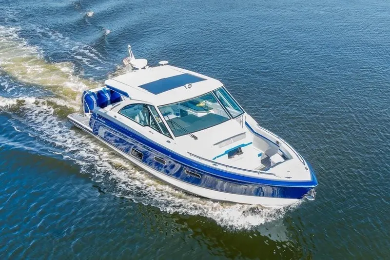 Slide: The Image of 2024 Formula 380 Super Sport Crossover OB cruising on open water. - 56