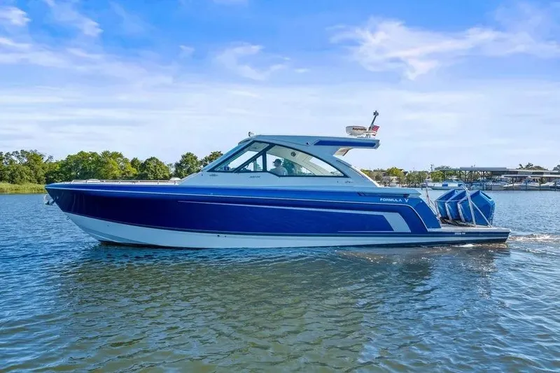 Slide: The Image of 2024 Formula 380 Super Sport Crossover OB boat cruising on a sunny day. - 57