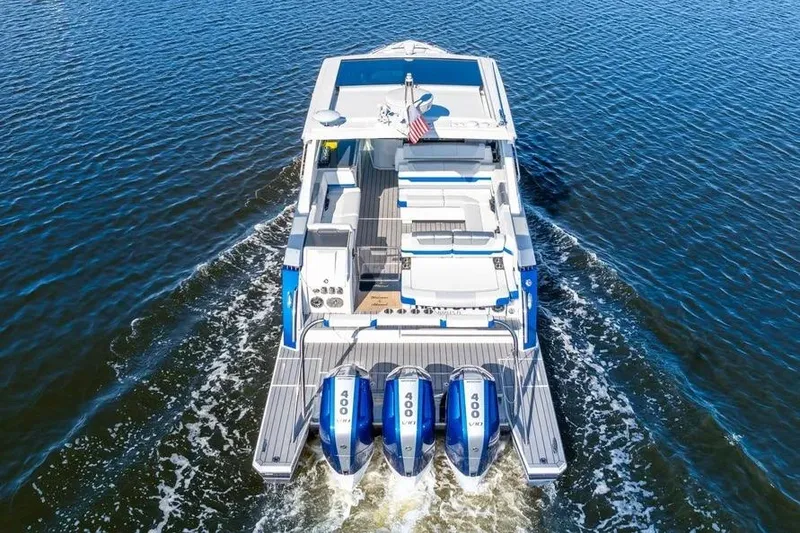 Slide: The Image of 2024 Formula 380 Super Sport Crossover OB cruising on open water, rear view. - 7