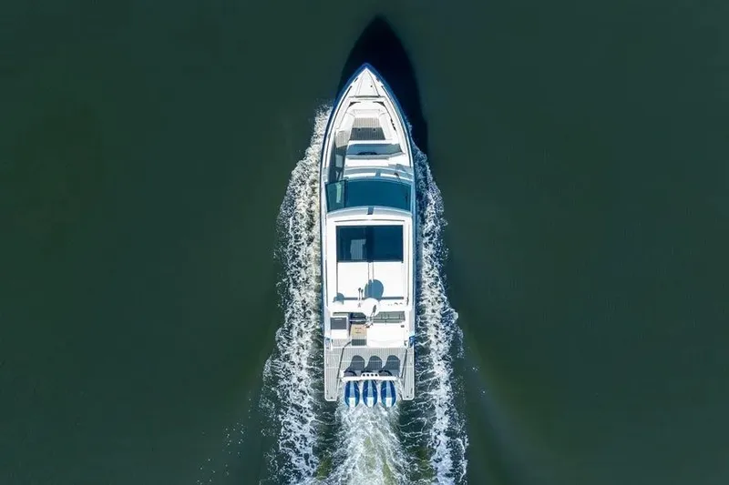 Slide: The Image of Aerial view of 2024 Formula 380 Super Sport Crossover OB cruising on water. - 9
