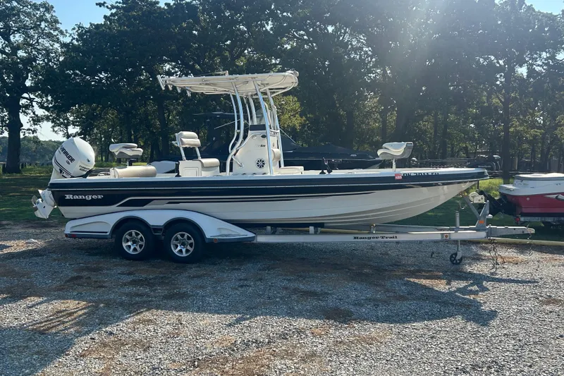 Slide: The Image of 2009 Ranger 2410 Bay Ranger boat on trailer, parked outdoors. - 1