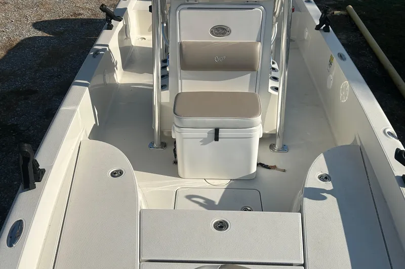 Slide: The Image of 2009 Ranger 2410 Bay Ranger boat interior with seating and storage compartments. - 15