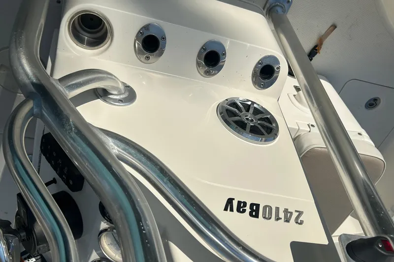 Slide: The Image of 2009 Ranger 2410 Bay boat console with rod holders and speaker. - 16