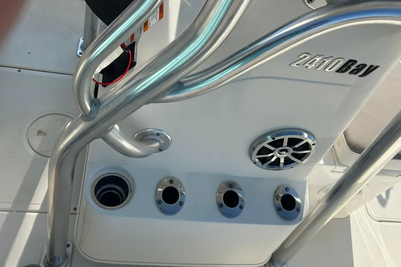 Slide: The Image of 2009 Ranger 2410 Bay Ranger boat console with rod holders and speaker. - 17