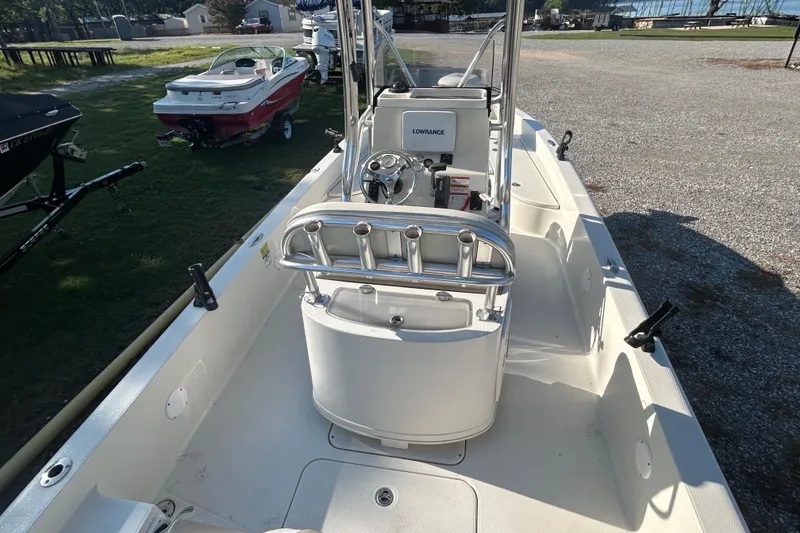 Slide: The Image of 2009 Ranger 2410 Bay Ranger boat interior with steering console and rod holders. - 8