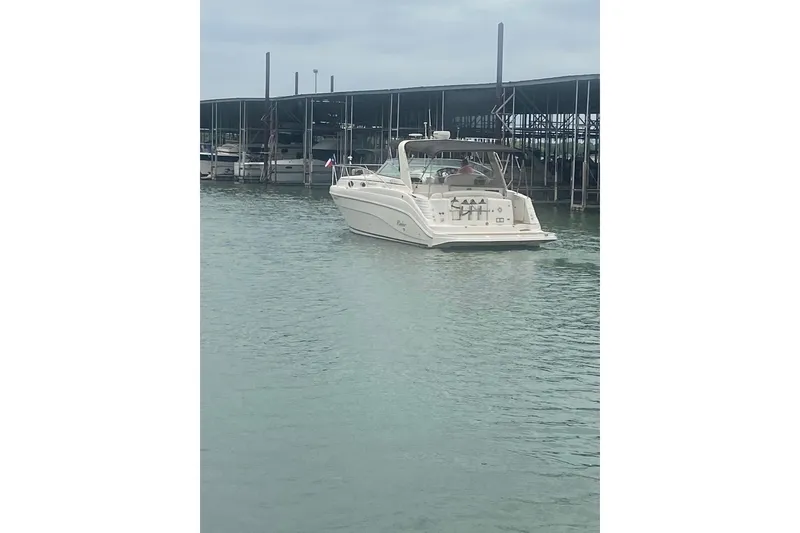 Slide: The Image of 2003 Rinker 342 Express Cruiser docked, named "Miss Linda Lou," Aubrey, Texas. - 4