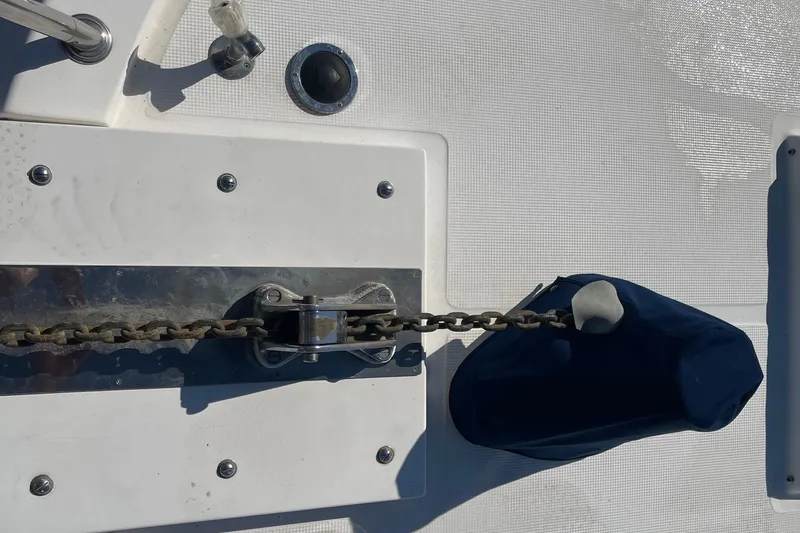 Slide: The Image of Anchor chain mechanism on 1997 McKinna 48 Pilothouse yacht deck. - 17