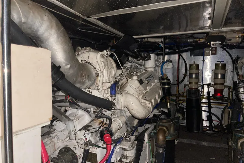 Slide: The Image of Engine room of a 1997 McKinna 48 Pilothouse yacht, showcasing mechanical components. - 25