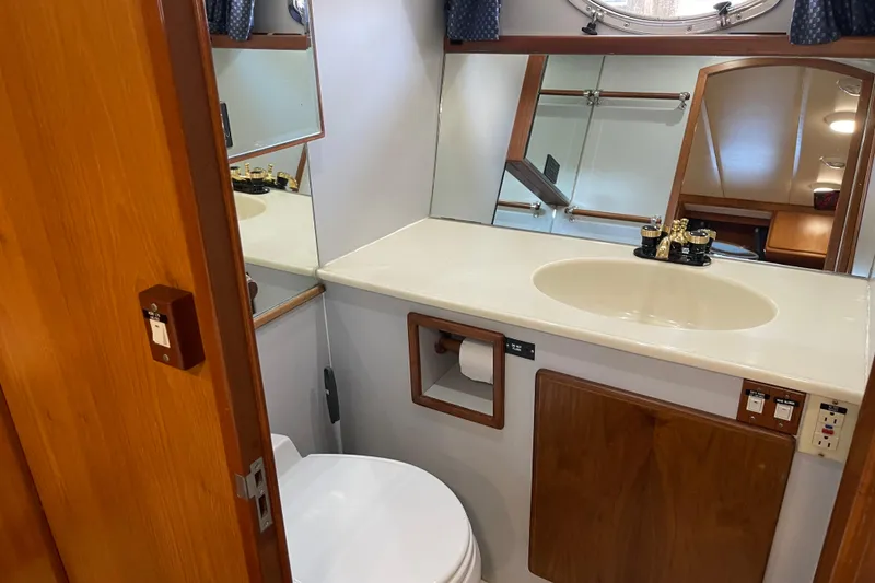 Slide: The Image of Bathroom interior of 1997 McKinna 48 Pilothouse yacht with sink and toilet. - 32