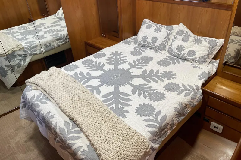 Slide: The Image of Cozy bedroom in 1997 McKinna 48 Pilothouse with floral bedding and wooden accents. - 35