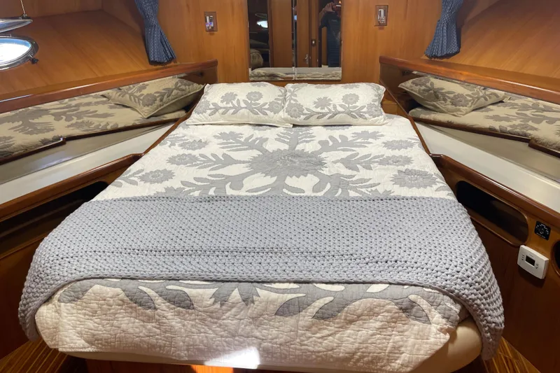Slide: The Image of Luxurious 1997 McKinna 48 Pilothouse cabin with cozy bed and elegant decor. - 38