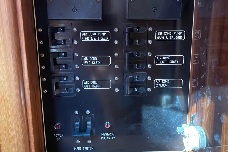 Slide: The Image of Electrical panel of a 1997 McKinna 48 Pilothouse, showing air conditioning controls. - 42