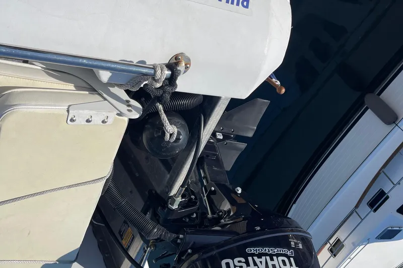 Slide: The Image of 1997 McKinna 48 Pilothouse boat with Tohatsu outboard motor detail. - 52