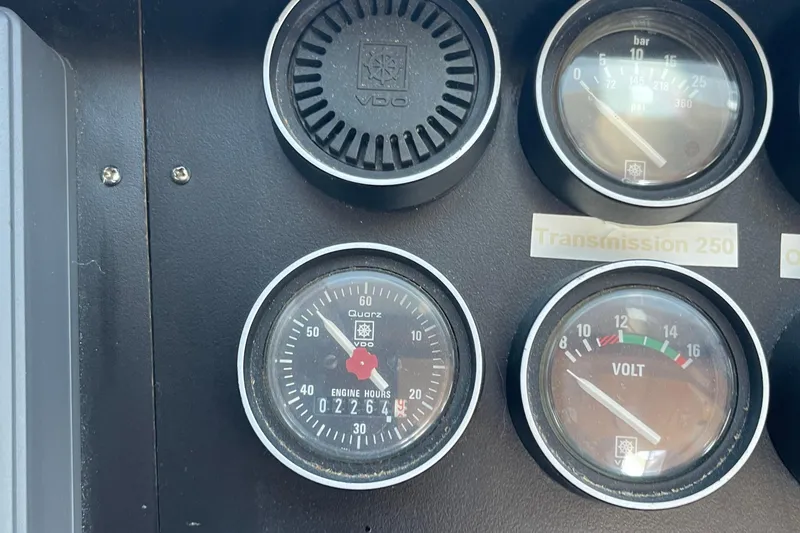 Slide: The Image of Instrument panel of a 1997 McKinna 48 Pilothouse with gauges and indicators. - 56