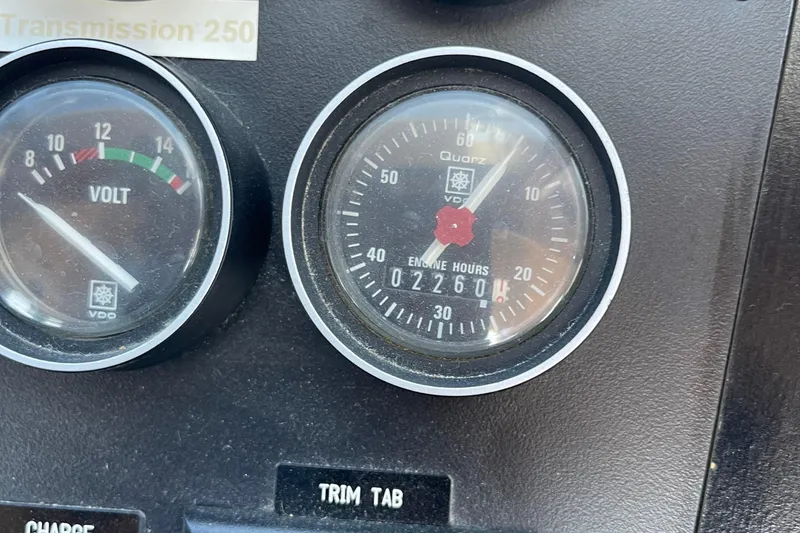 Slide: The Image of Close-up of McKinna 48 Pilothouse 1997 dashboard gauges showing voltmeter and engine hours. - 57