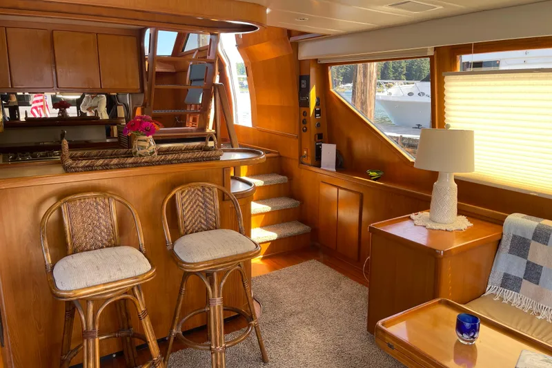 Slide: The Image of Luxurious interior of a 1997 McKinna 48 Pilothouse yacht with elegant wood finishes. - 75