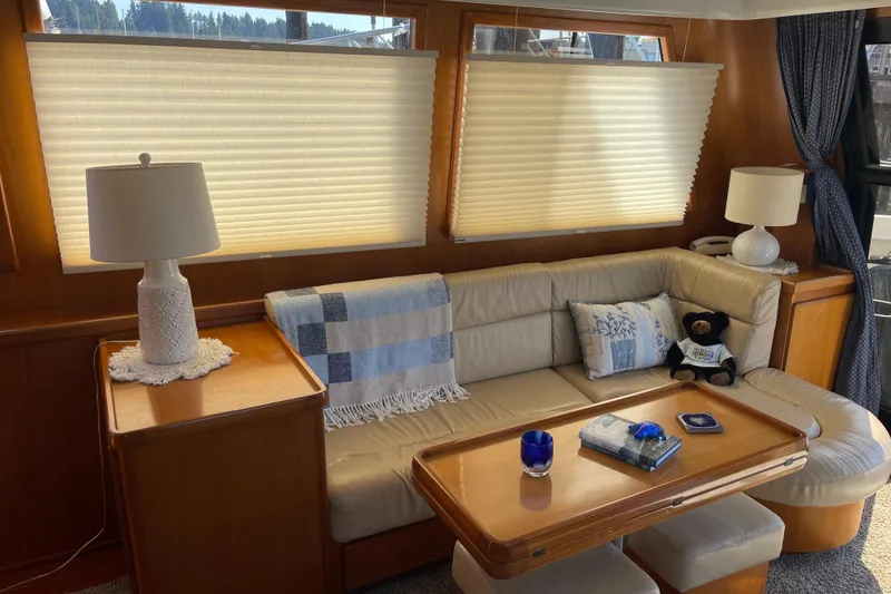 Slide: The Image of Cozy interior of 1997 McKinna 48 Pilothouse with plush seating and elegant decor. - 78