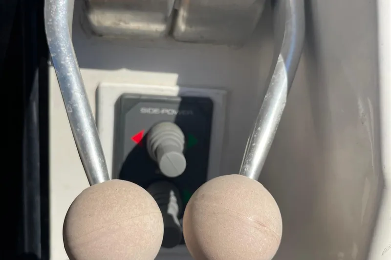 Slide: The Image of Close-up of throttle controls on a 1997 McKinna 48 Pilothouse boat. - 8
