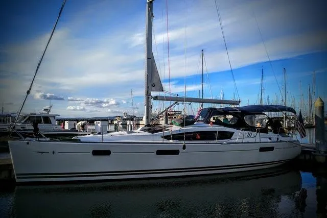 The Image of 2011 Jeanneau Sun Odyssey 42 DS sailboat docked, featuring sleek design and modern rigging. - 0