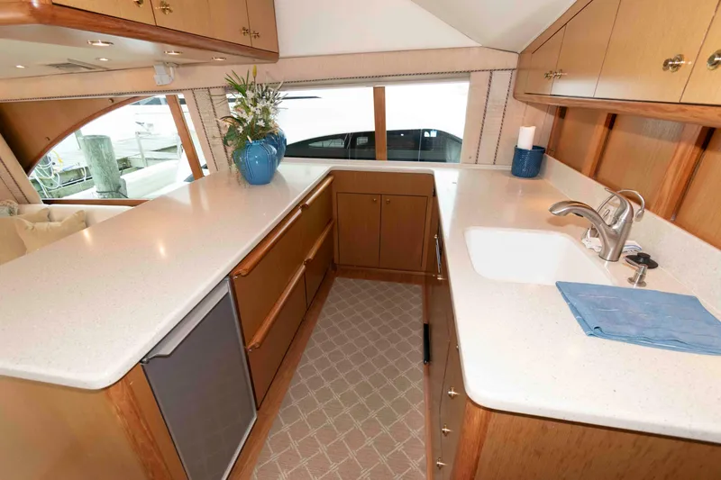 Slide: The Image of Luxurious kitchen interior of 2004 Ocean Yachts 52 SUPER SPORT with modern amenities. - 25