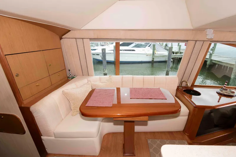 Slide: The Image of Luxurious interior of 2004 Ocean Yachts 52 SUPER SPORT with elegant dining area. - 26