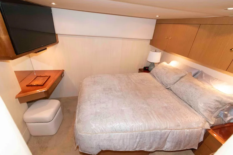 Slide: The Image of Luxurious bedroom interior of 2004 Ocean Yachts 52 SUPER SPORT with TV and elegant bedding. - 27