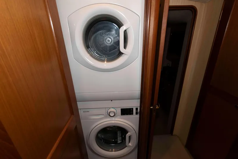 Slide: The Image of Stacked washer and dryer in 2004 Ocean Yachts 52 SUPER SPORT interior. - 34