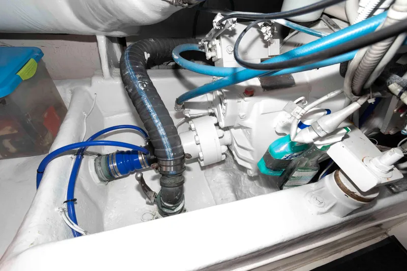 Slide: The Image of Engine room of 2004 Ocean Yachts 52 SUPER SPORT with visible hoses and components. - 40