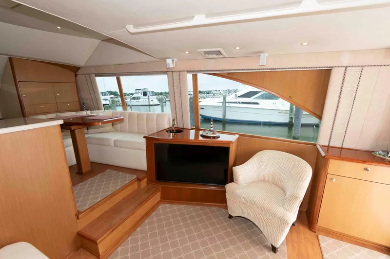Slide: The Image of Luxurious interior of 2004 Ocean Yachts 52 Super Sport with elegant seating and large windows. - 22