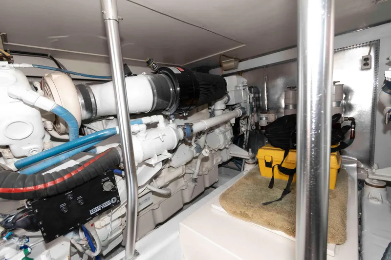Slide: The Image of Engine room of 2004 Ocean Yachts 52 SUPER SPORT with visible equipment and storage. - 38