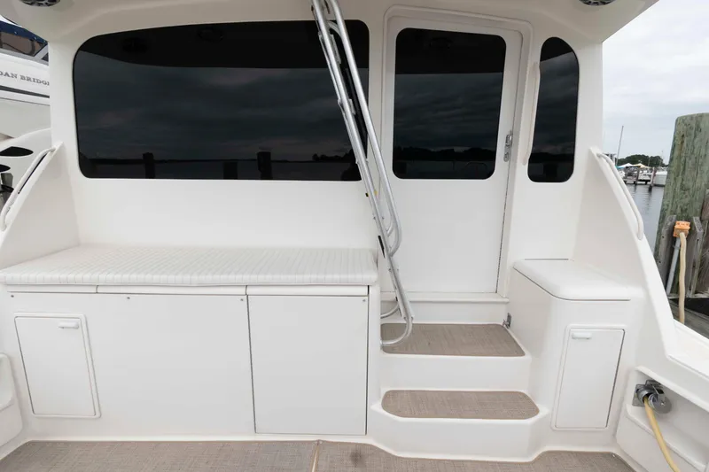 Slide: The Image of 2004 Ocean Yachts 52 Super Sport yacht deck with seating and steps. - 5