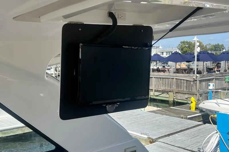 Slide: The Image of Mounted TV on 2017 Regal 35 Sport Coupe yacht, dockside view. - 21