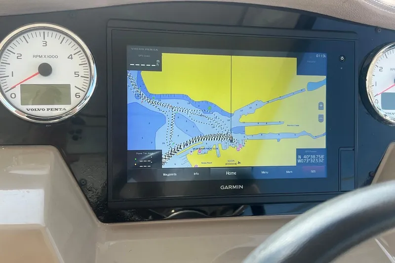 Slide: The Image of Dashboard of 2017 Regal 35 Sport Coupe with Garmin navigation display and Volvo Penta gauges. - 9