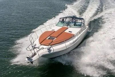 The Image of 1997 Sea Ray 400 Express Cruiser speeding on open water, showcasing sleek design. - 1