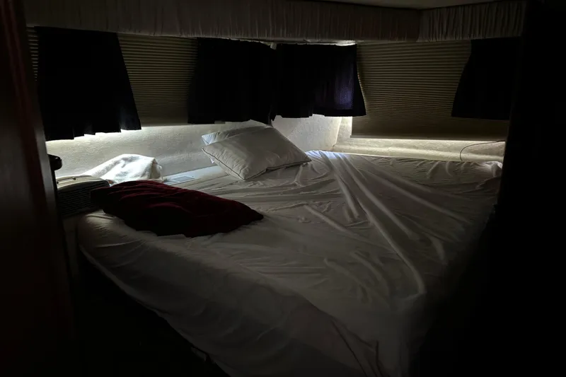 Slide: The Image of Cozy bedroom in 1990 Carver 3608 Aft Cabin yacht with dim lighting. - 15